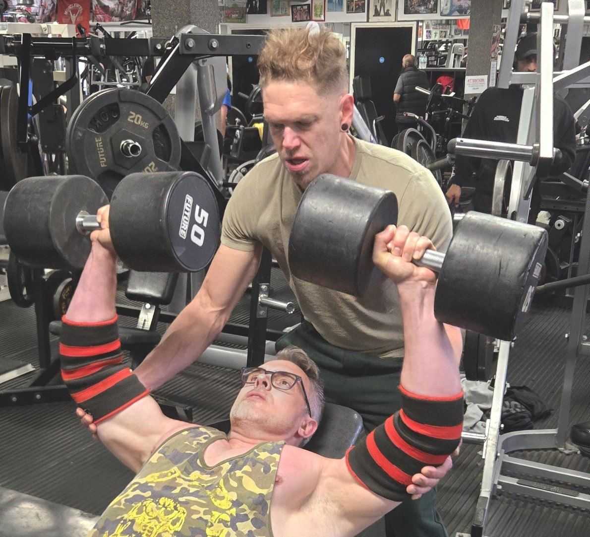 Matt spotting a client on the incline dumbbell press