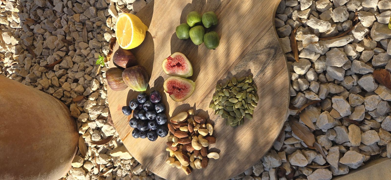 A board of fruit, nuts and seeds